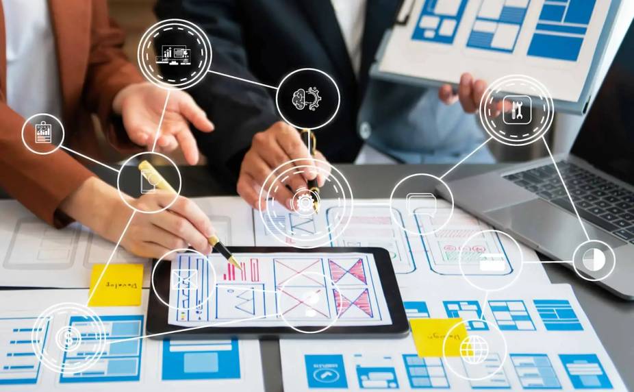 Team planning UI/UX wireframes for a web application development company using digital tools and
diagrams