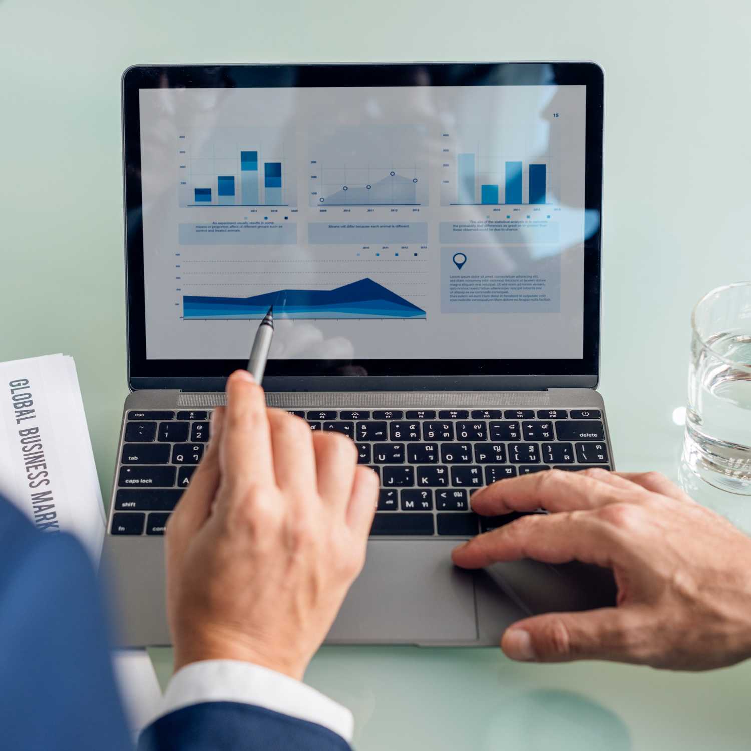 business professional analyzing credit cooperative society software dashboard with financial charts
and performance metrics