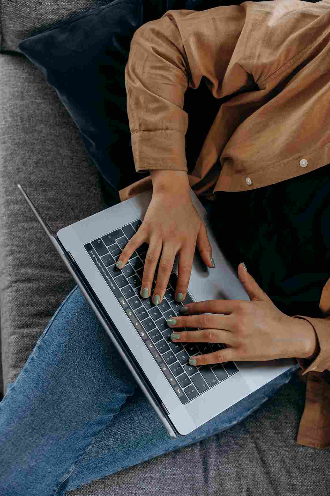 Person working on laptop for a custom web application development company project from a
remote locationimage