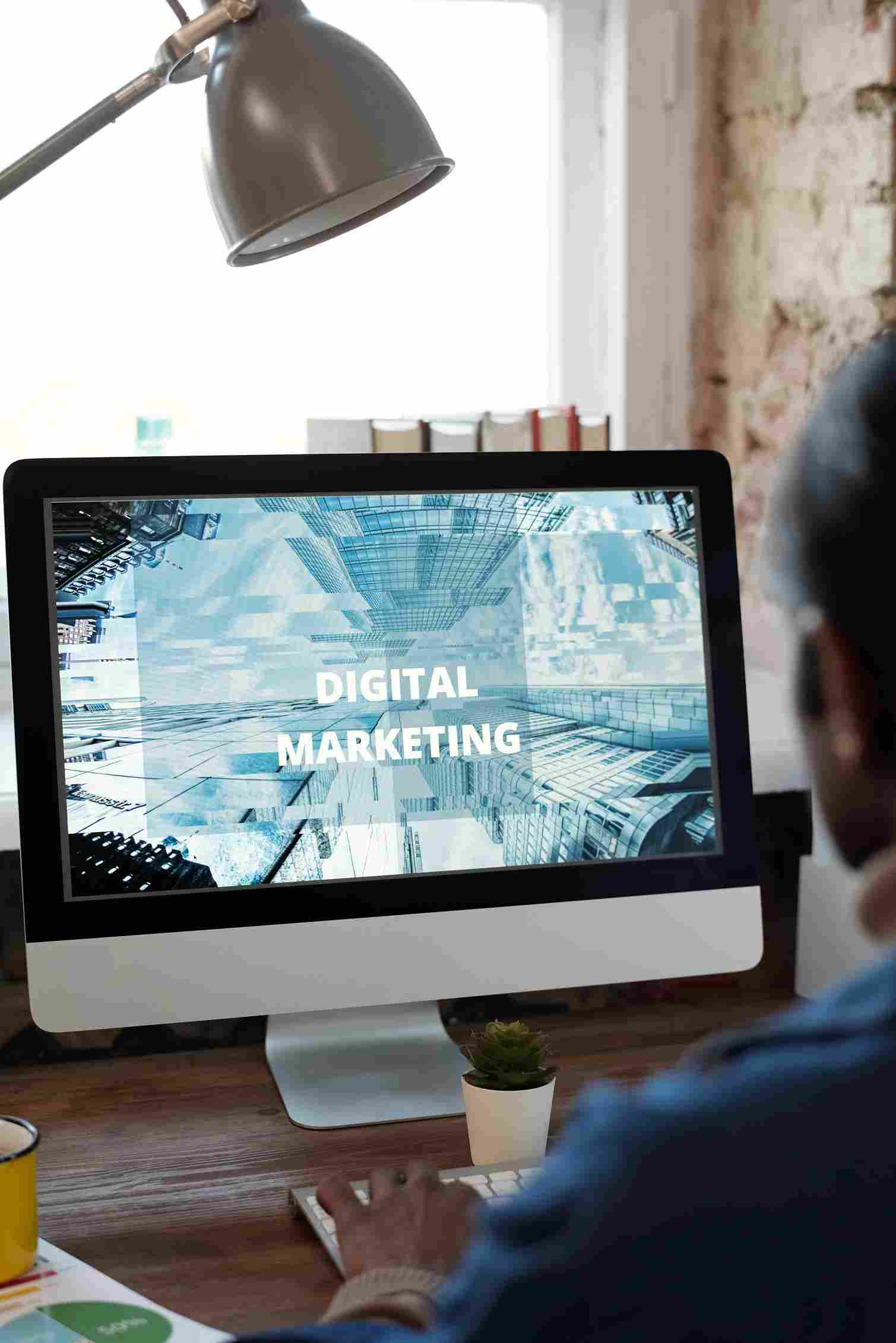Person working at desk with digital marketing content on screen, for the best digital marketing
agency in Dehradun.